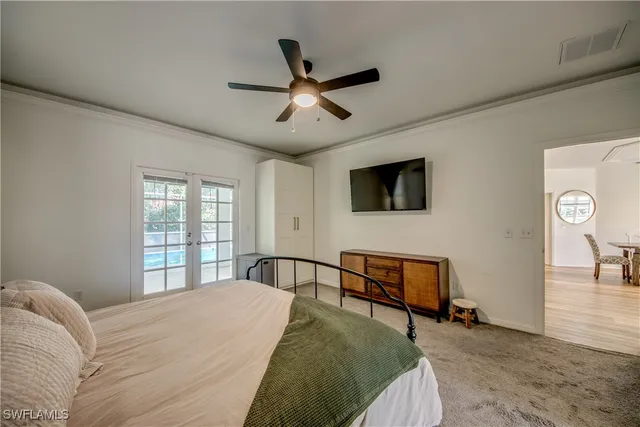 a bed room with a bed and a television