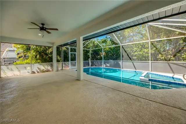 a view of a room with wooden floor and windows