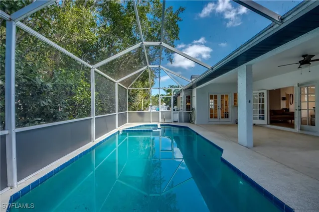 a view of a backyard with sitting area