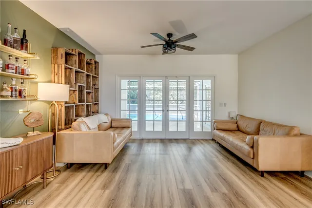 a living room with furniture and a window