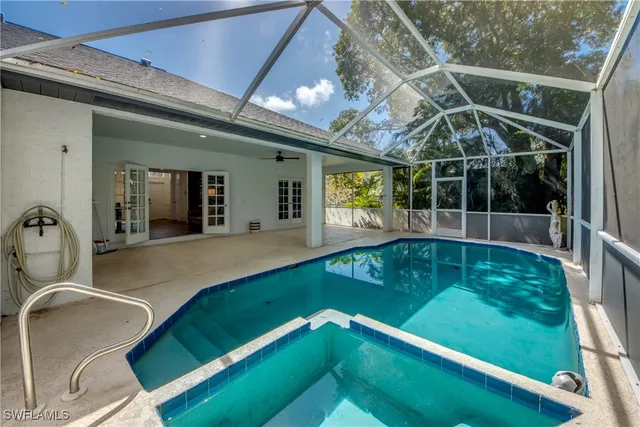 a view of a backyard with a patio and a garden