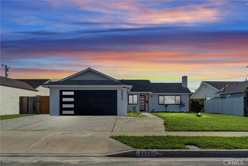 6032 Vane Circle Huntington Beach, CA 92647 - Photo 1 of 56 a front view of a house with a yard