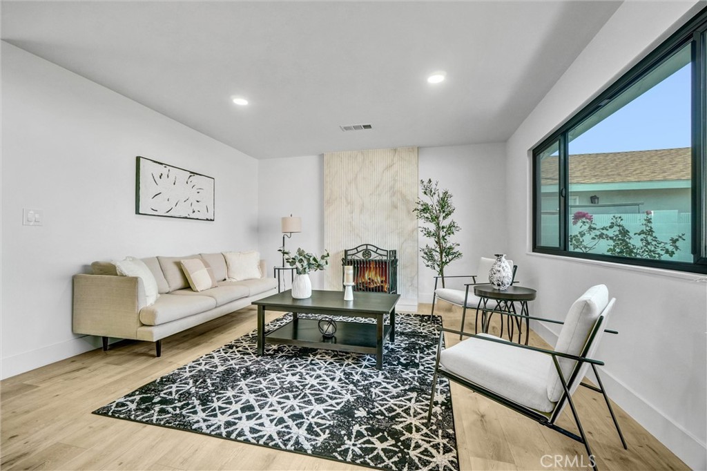 6032 Vane Circle Huntington Beach, CA 92647 - Photo 11 of 56 a living room with furniture and a large window
