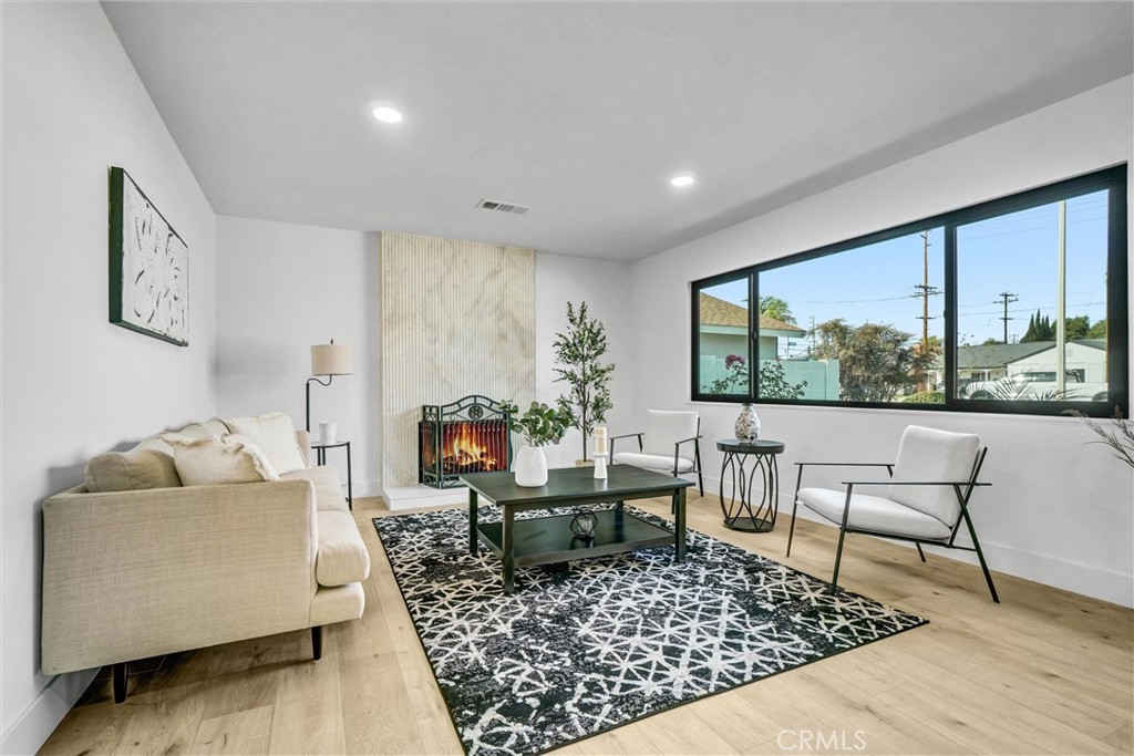 6032 Vane Circle Huntington Beach, CA 92647 - Photo 12 of 56 a living room with furniture and a large window