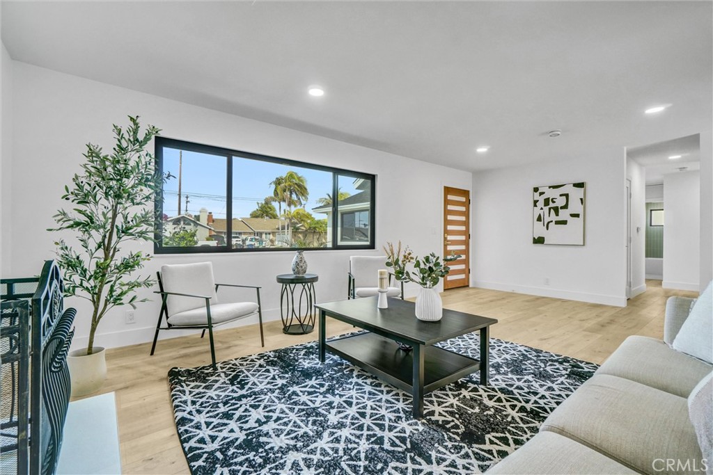6032 Vane Circle Huntington Beach, CA 92647 - Photo 13 of 56 a living room with furniture and a rug