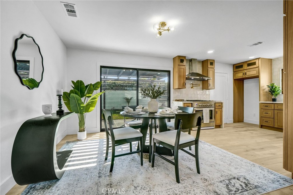 6032 Vane Circle Huntington Beach, CA 92647 - Photo 15 of 56 a dining room with furniture and window