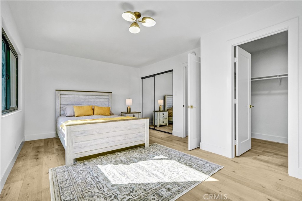 6032 Vane Circle Huntington Beach, CA 92647 - Photo 22 of 56 a living room with a bed furniture and a window