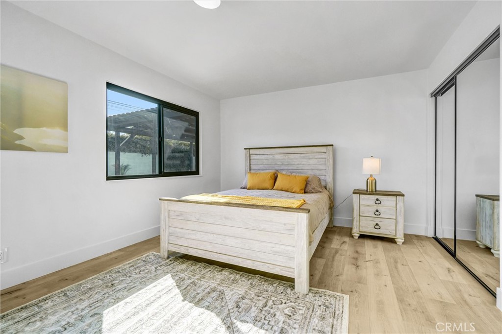 6032 Vane Circle Huntington Beach, CA 92647 - Photo 23 of 56 a bedroom with a bed and a window