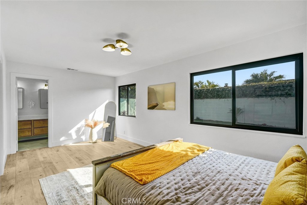 6032 Vane Circle Huntington Beach, CA 92647 - Photo 25 of 56 a bedroom with a bed and a window