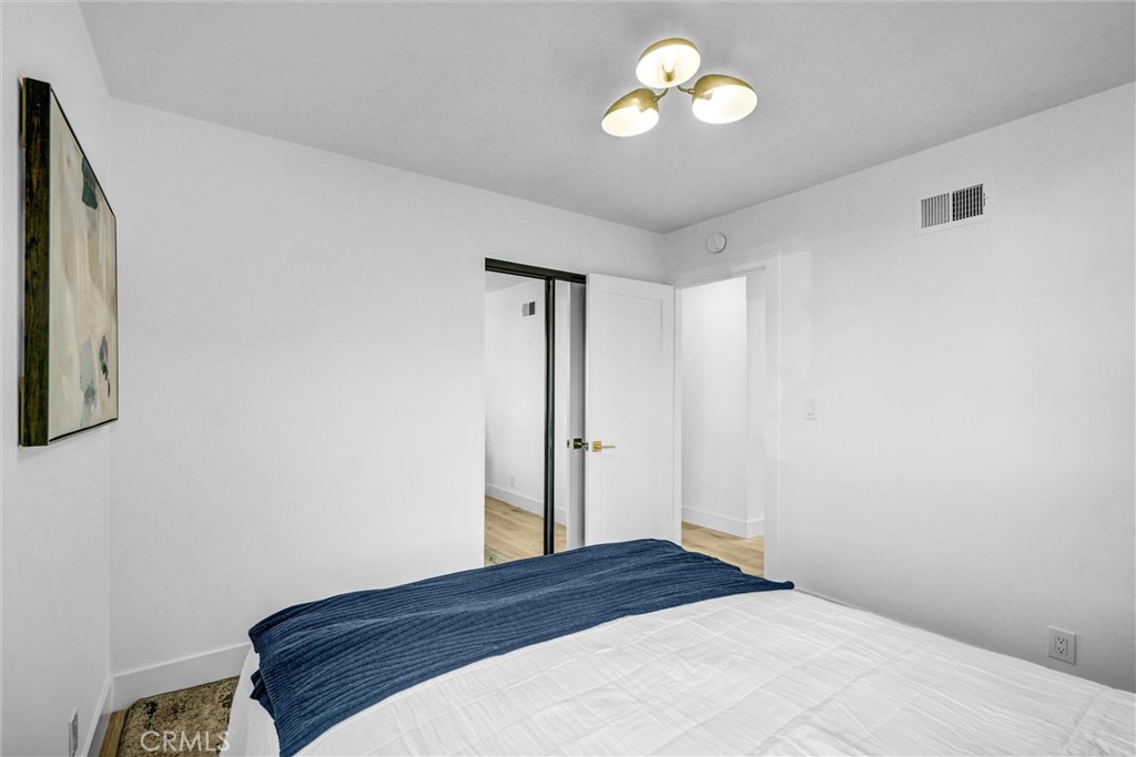 6032 Vane Circle Huntington Beach, CA 92647 - Photo 30 of 56 a bedroom with a bed and a window