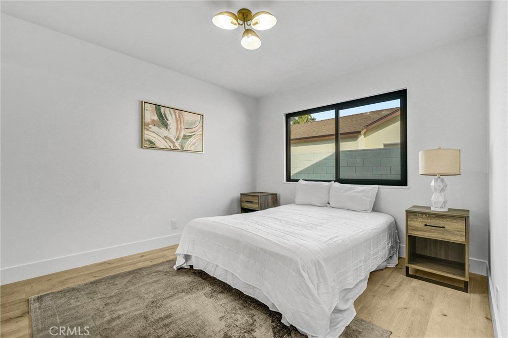 6032 Vane Circle Huntington Beach, CA 92647 - Photo 32 of 56 a bedroom with a bed and a window