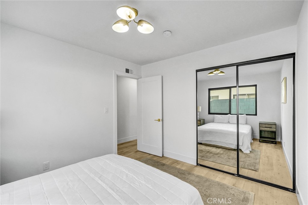 6032 Vane Circle Huntington Beach, CA 92647 - Photo 33 of 56 a bedroom with a bed and a window