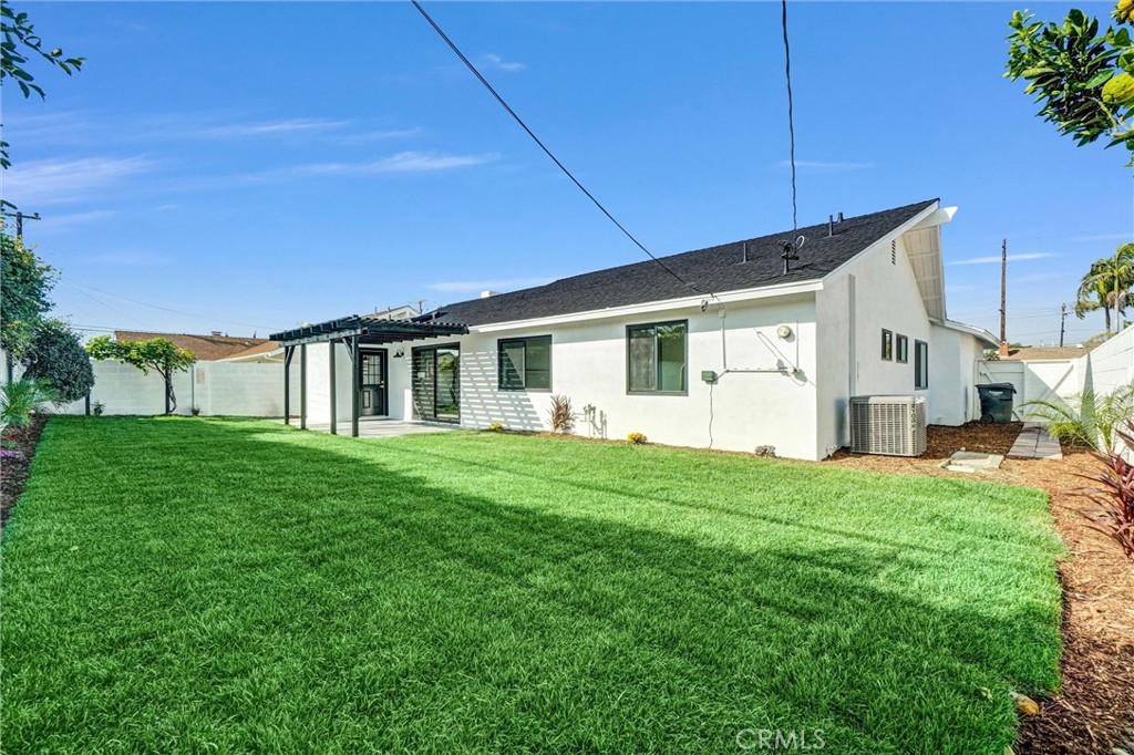 6032 Vane Circle Huntington Beach, CA 92647 - Photo 39 of 56 a view of a house with a backyard
