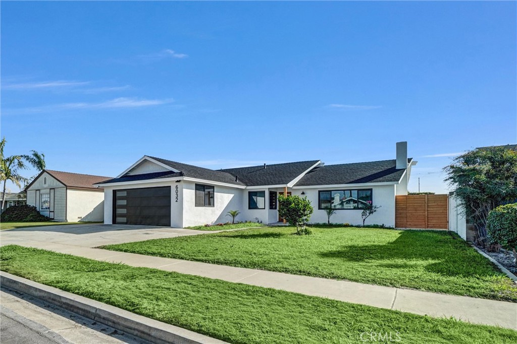 6032 Vane Circle Huntington Beach, CA 92647 - Photo 41 of 56 a front view of a house with a yard