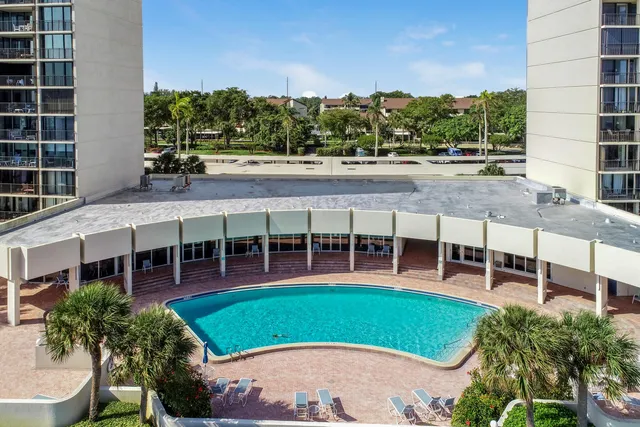 an aerial view of a house with a garden and plants