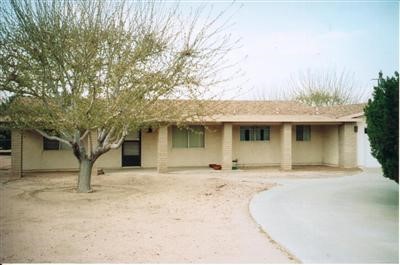 14868 Ranchero Road Hesperia, CA 92345 - Photo 1 of 1 a front view of a house with a yard