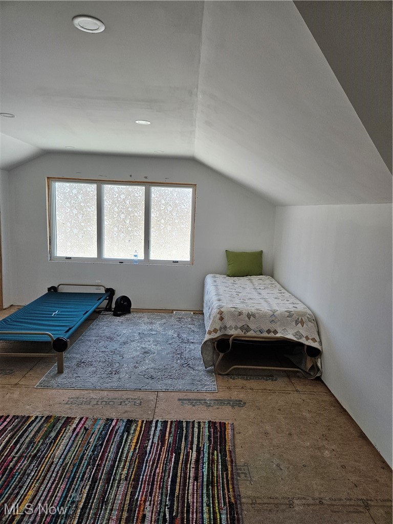 1180 North County Line Road Geneva, OH 44041 - Photo 25 of 33 Bedroom with lofted ceiling