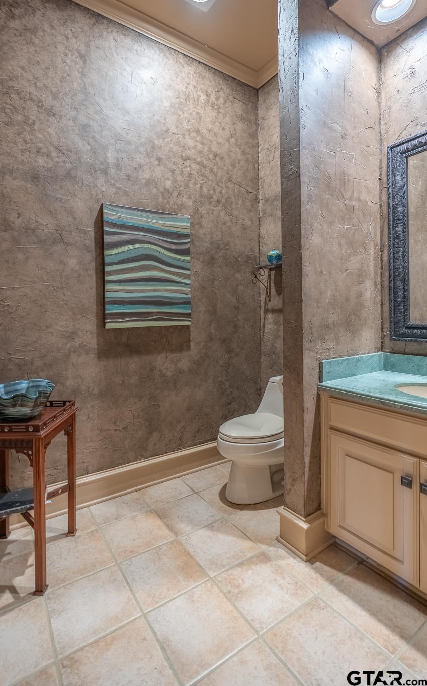 1520 Clubview Drive Tyler, TX 75701 - Photo 15 of 48 a bathroom with a sink a toilet and shower