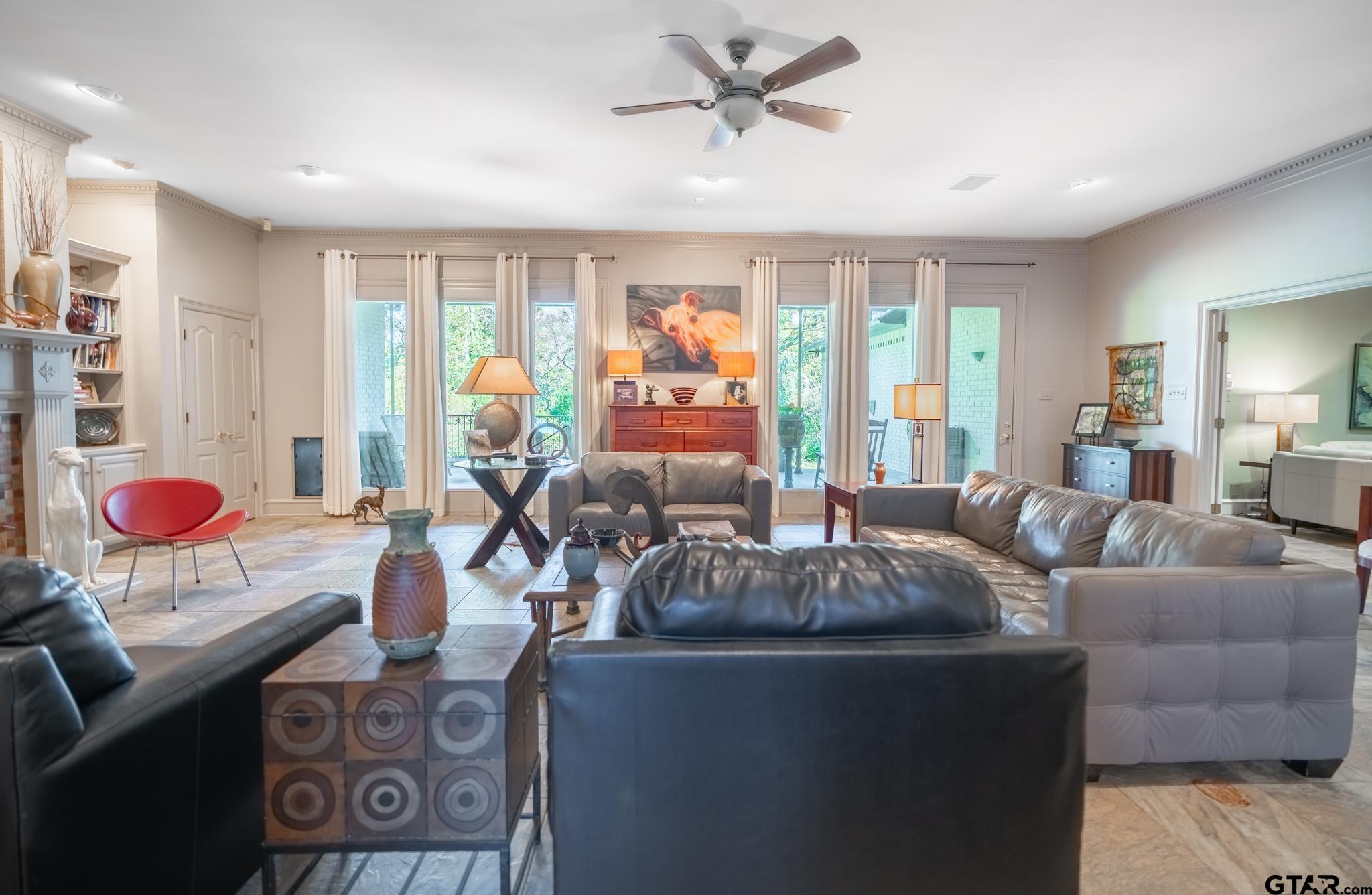 1520 Clubview Drive Tyler, TX 75701 - Photo 17 of 48 a living room with furniture and a large window