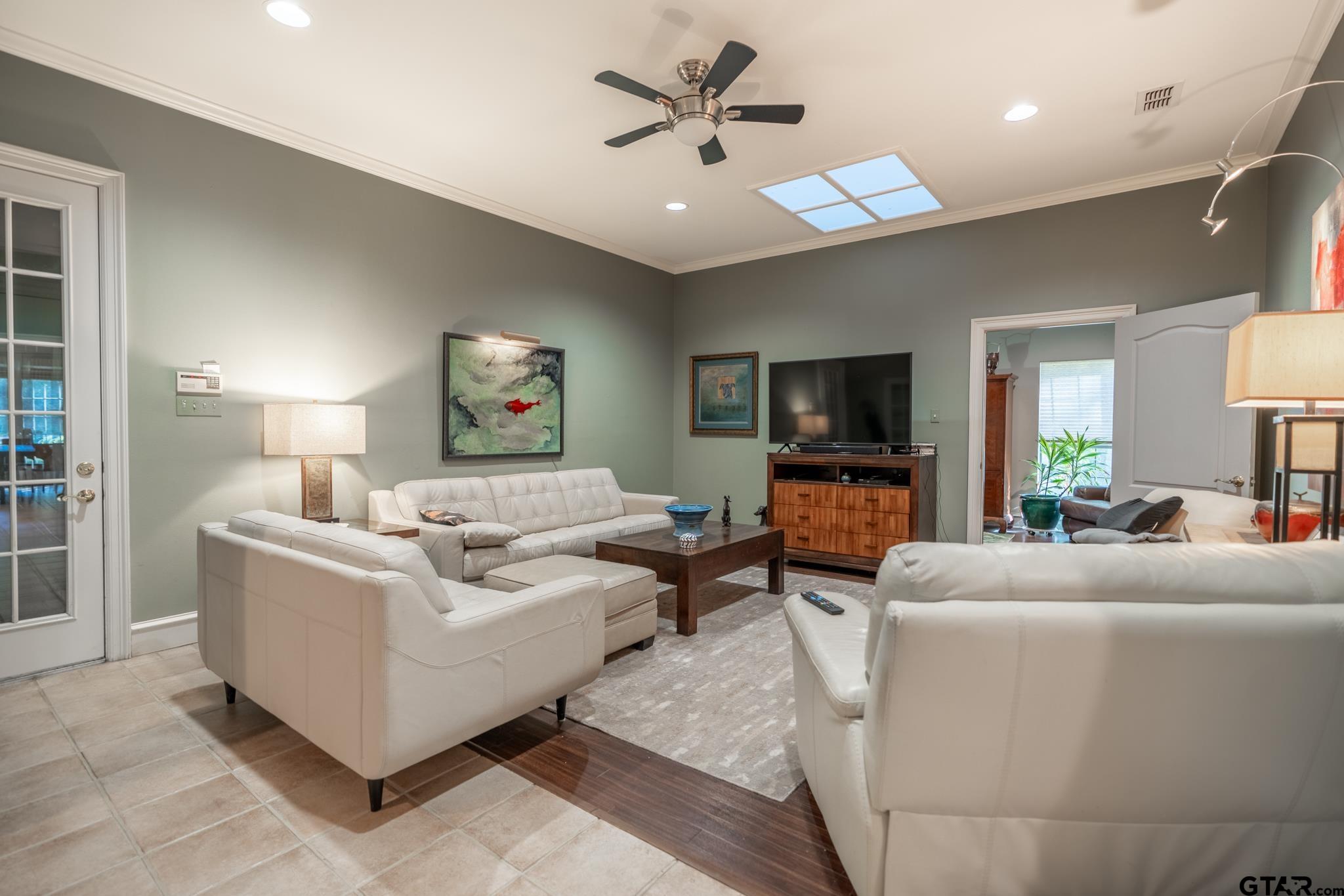 1520 Clubview Drive Tyler, TX 75701 - Photo 19 of 48 a living room with furniture and a flat screen tv
