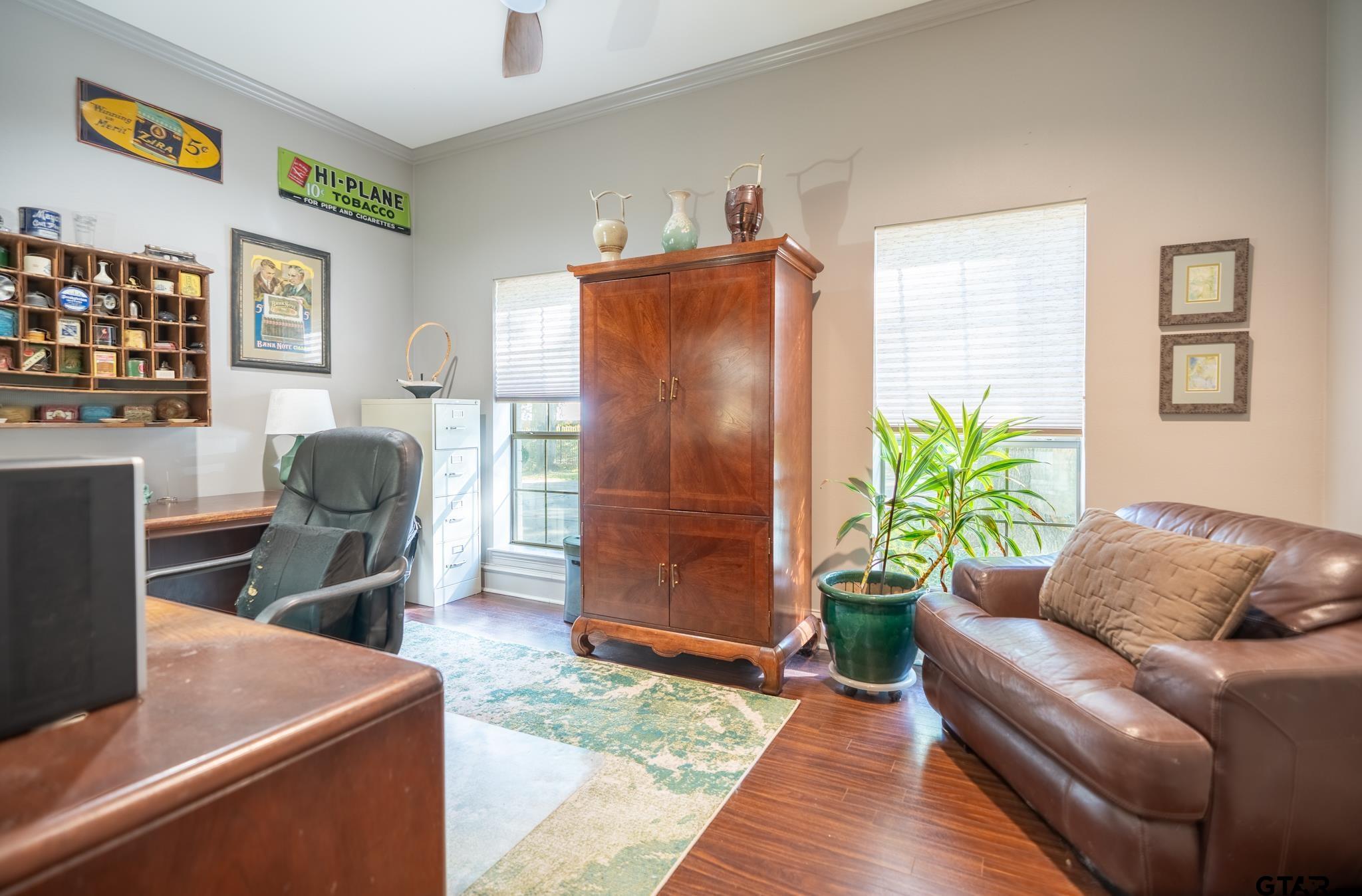 1520 Clubview Drive Tyler, TX 75701 - Photo 22 of 48 a living room with furniture and a potted plant