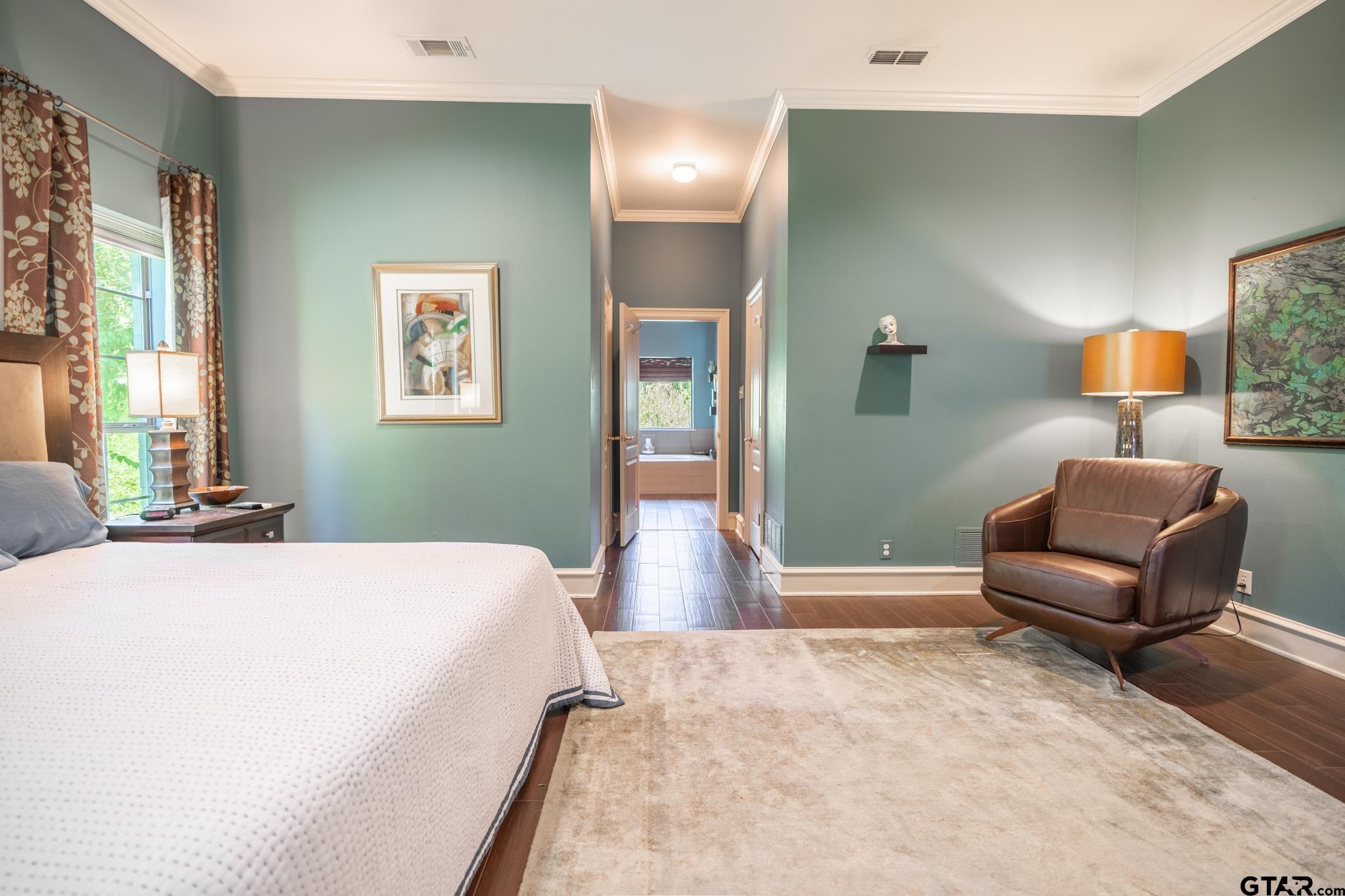 1520 Clubview Drive Tyler, TX 75701 - Photo 25 of 48 a bedroom with a bed and a couch