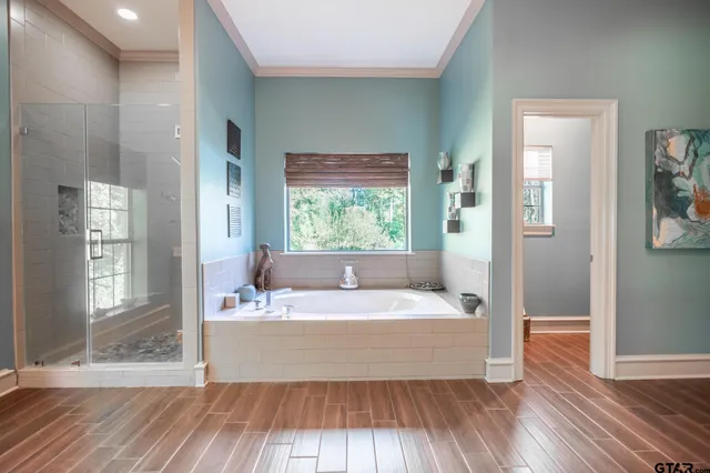 a spacious bathroom with a bathtub and a sink