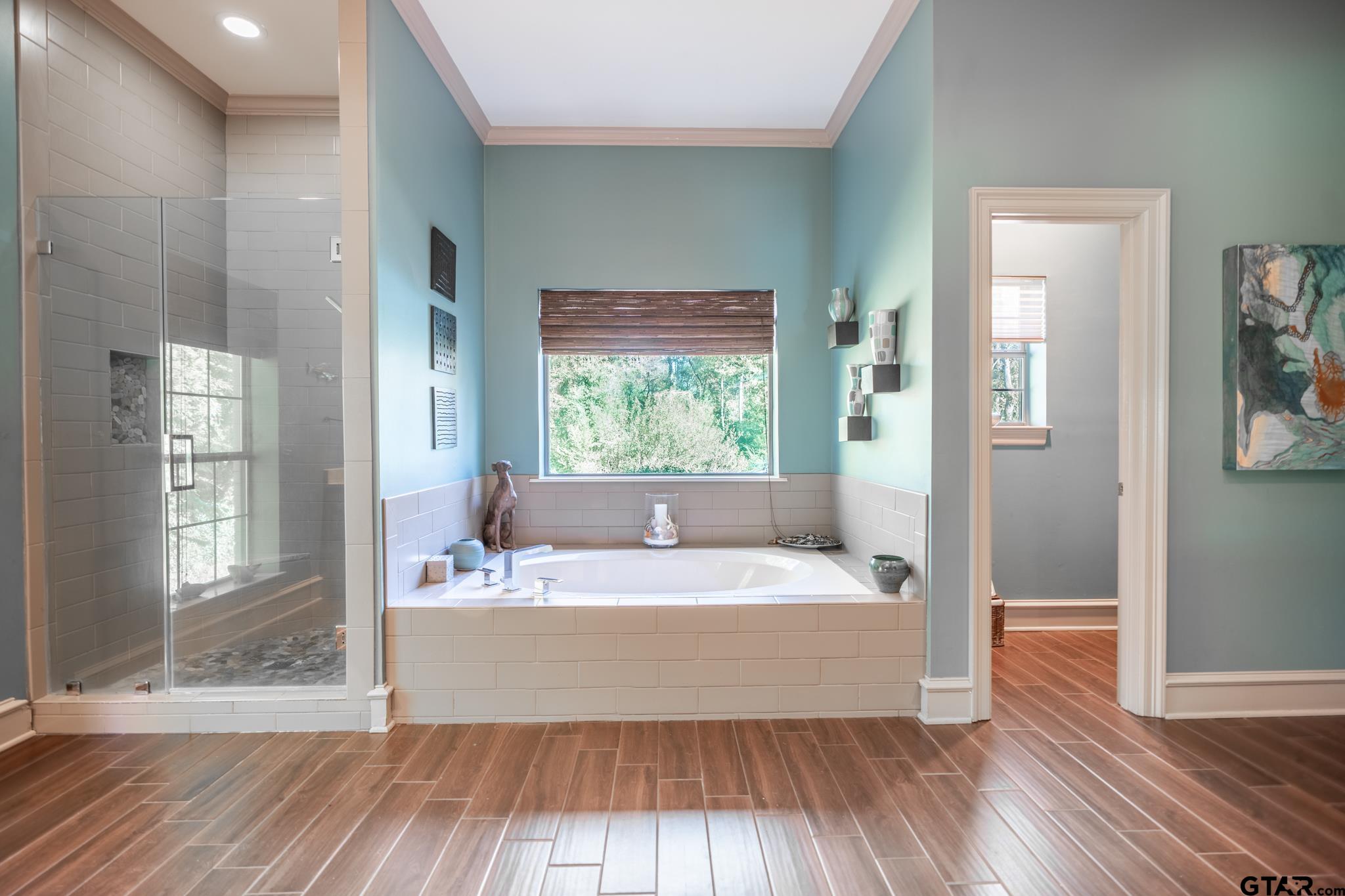 1520 Clubview Drive Tyler, TX 75701 - Photo 26 of 48 a spacious bathroom with a bathtub and a sink