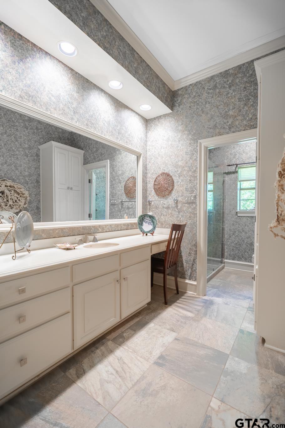 1520 Clubview Drive Tyler, TX 75701 - Photo 31 of 48 a spacious bathroom with a double vanity sink and a mirror