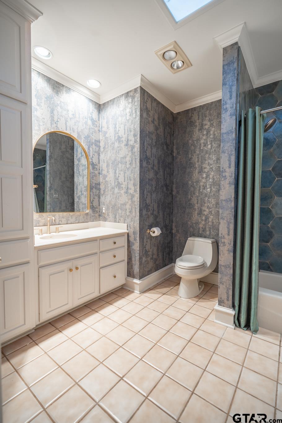 1520 Clubview Drive Tyler, TX 75701 - Photo 36 of 48 a spacious bathroom with a double vanity sink mirror and toilet