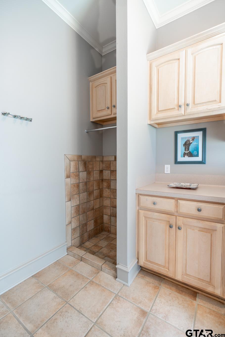 1520 Clubview Drive Tyler, TX 75701 - Photo 40 of 48 a bathroom with a granite countertop sink and cabinets