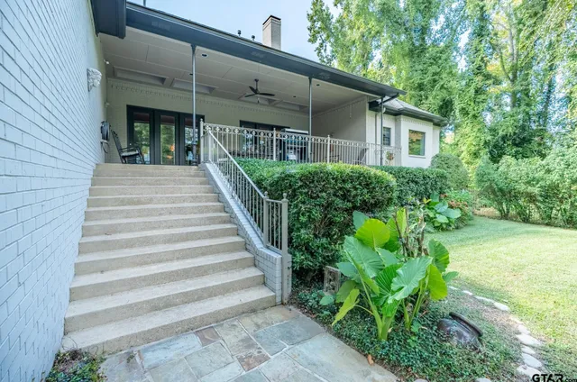 a view of a house with potted plants