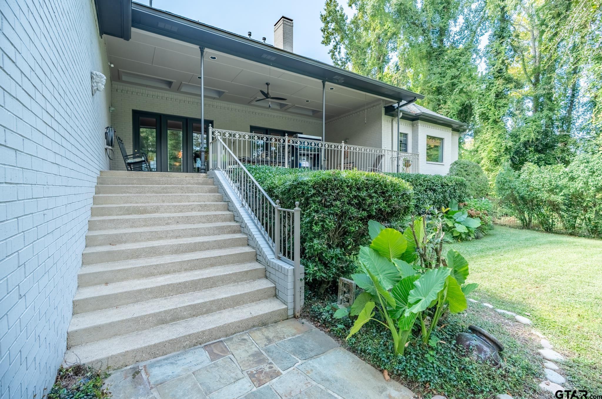 1520 Clubview Drive Tyler, TX 75701 - Photo 43 of 48 a view of a house with potted plants