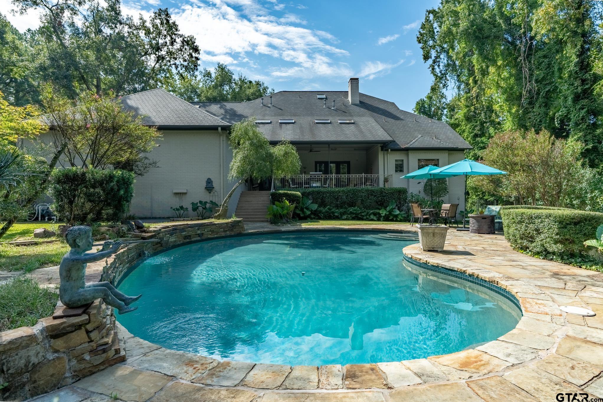 1520 Clubview Drive Tyler, TX 75701 - Photo 44 of 48 a view of a house with backyard fountain and sitting area