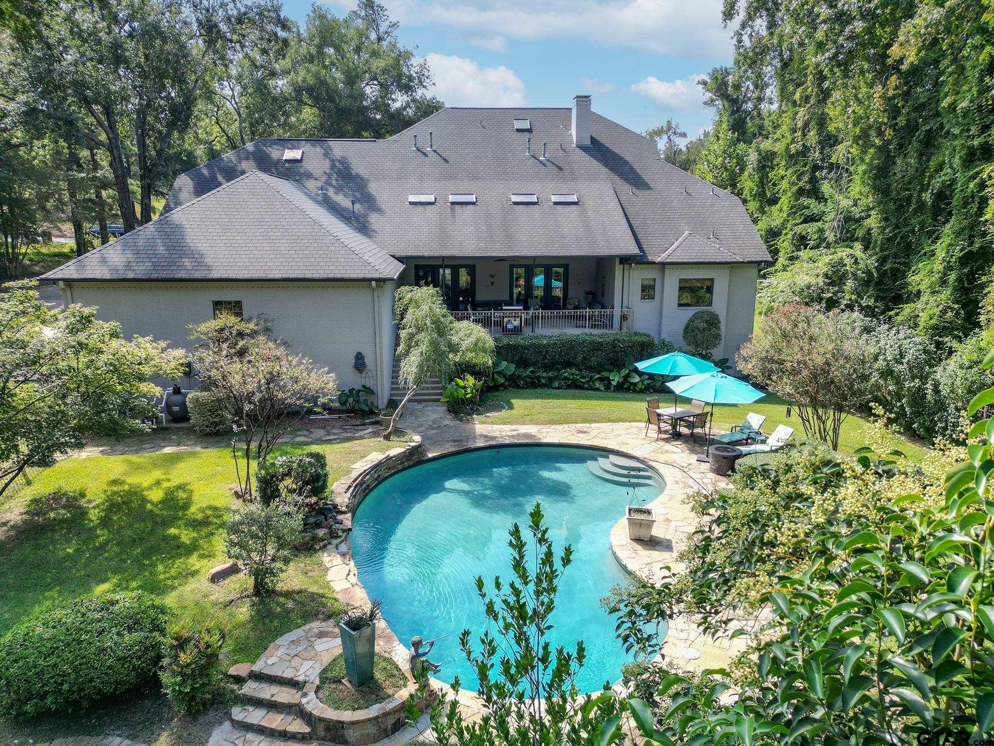 1520 Clubview Drive Tyler, TX 75701 - Photo 45 of 48 a view of a house with swimming pool and a yard