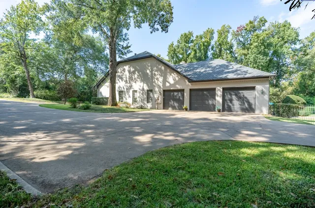 a view of house with yard