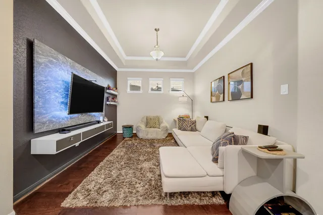 a living room with a couch and a flat screen tv