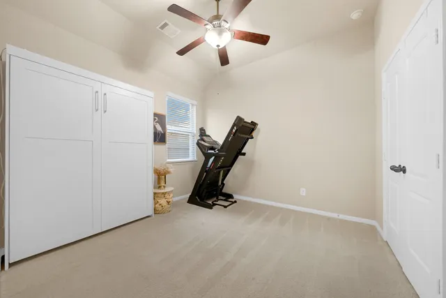 a view of room with gym equipment