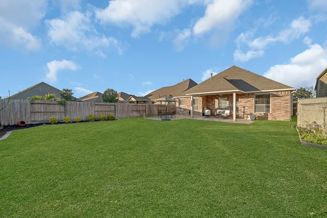 a view of a house with a big yard