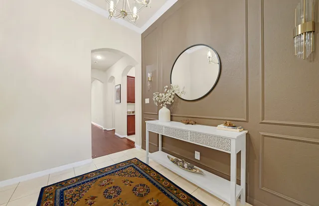 a room with a stove a mirror and a fan