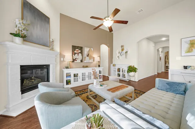 a living room with furniture and a fireplace