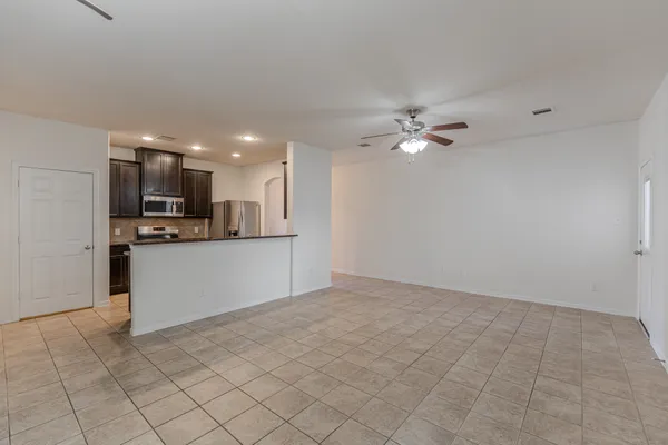 a view of a kitchen with microwave and cabinets