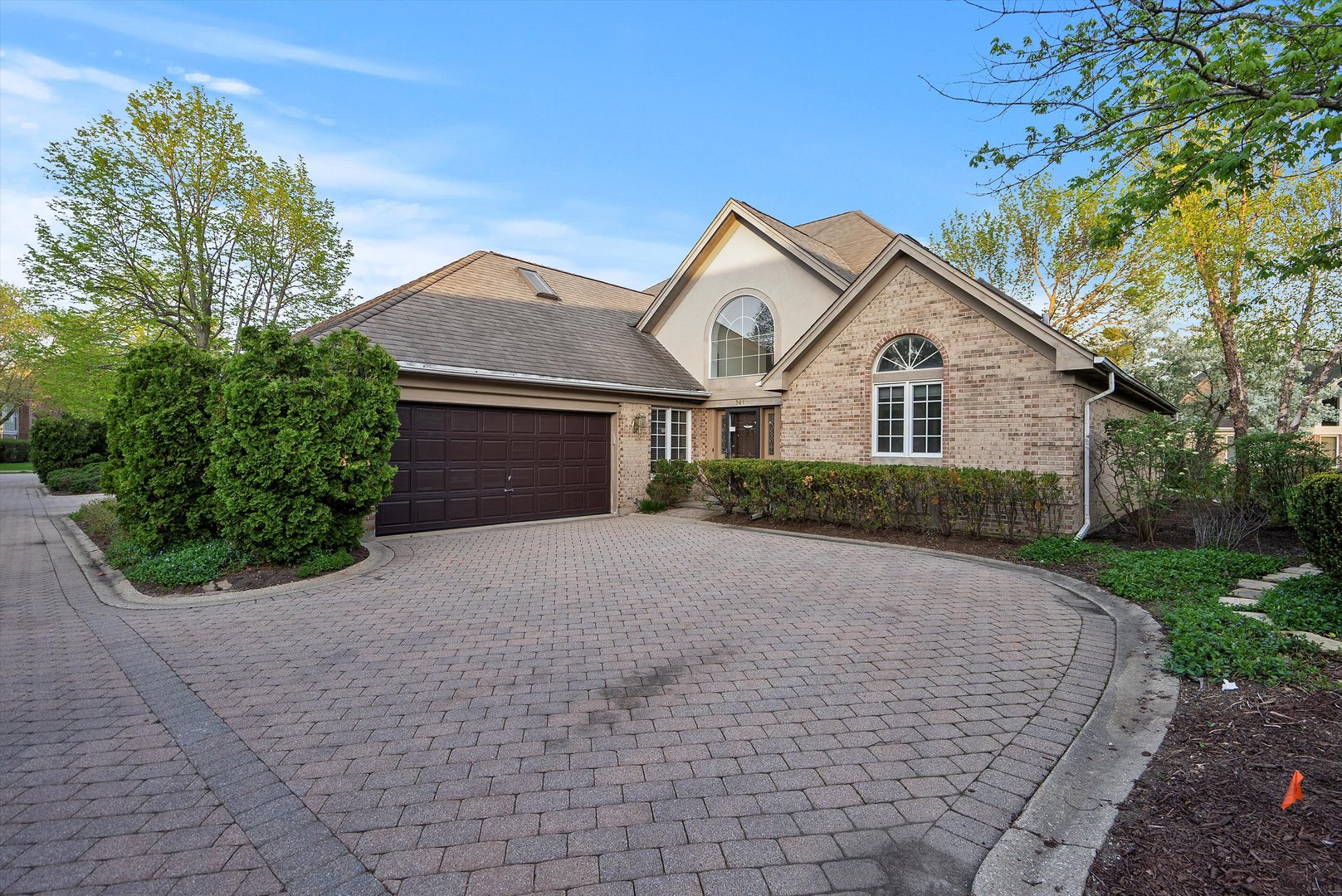 341 Rivershire Court Lincolnshire, IL 60069 - Photo 1 of 32 a front view of a house with a yard and garage