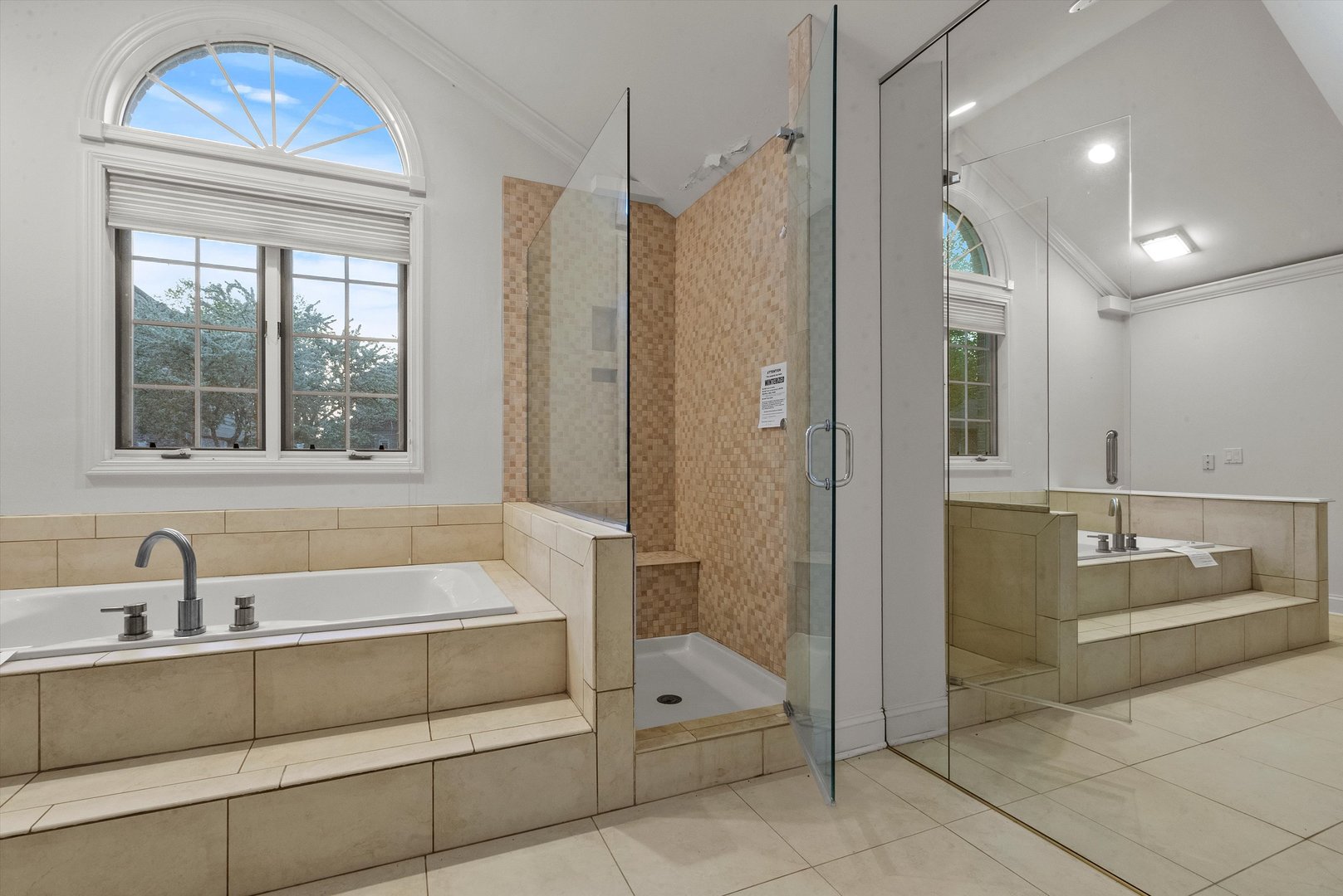 341 Rivershire Court Lincolnshire, IL 60069 - Photo 22 of 32 a bathroom with a tub a sink and a large mirror