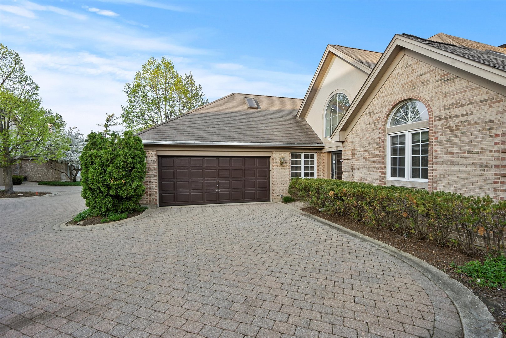 341 Rivershire Court Lincolnshire, IL 60069 - Photo 4 of 32 a front view of a house with a yard and garage