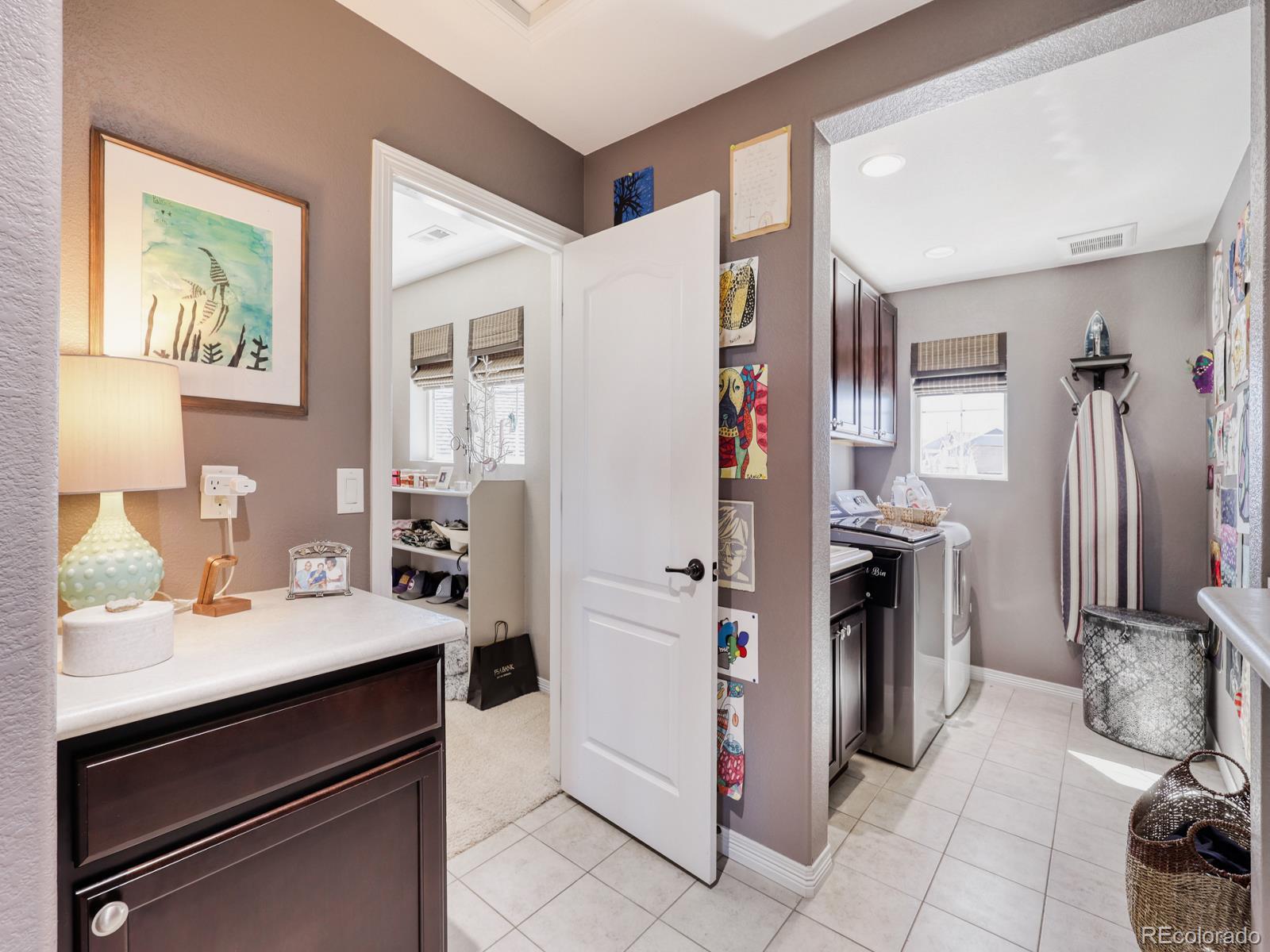 2964 Whitewing Way Castle Rock, CO 80108 - Photo 20 of 31 a kitchen with a refrigerator and a sink