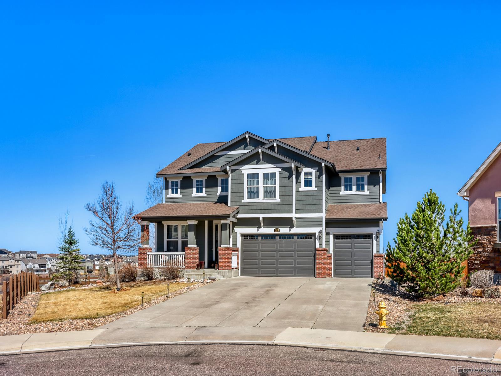 2964 Whitewing Way Castle Rock, CO 80108 - Photo 2 of 31 a front view of a house with a yard