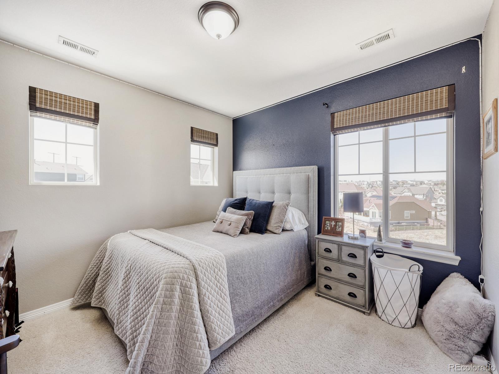 2964 Whitewing Way Castle Rock, CO 80108 - Photo 24 of 31 a bedroom with a bed and a large window