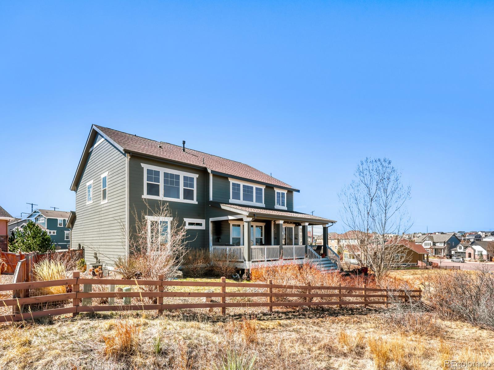 2964 Whitewing Way Castle Rock, CO 80108 - Photo 3 of 31 a front view of a house with a yard
