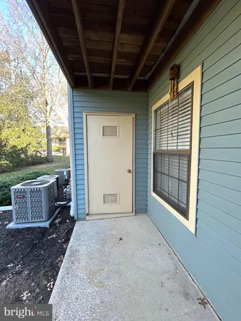 a view of livingroom with furniture and next to window
